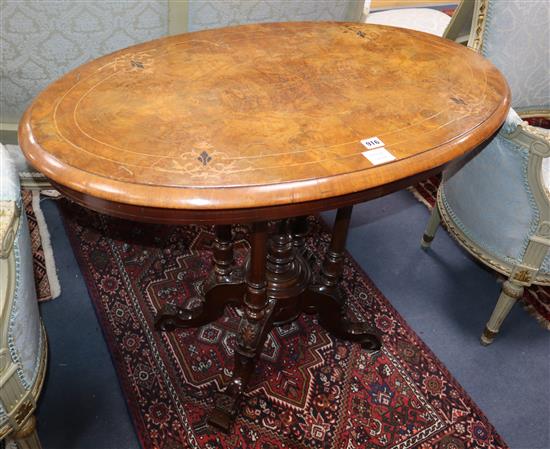 A Victorian inlaid walnut oval topped centre table W.90cm